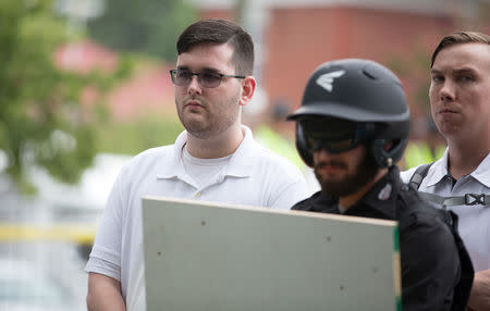James Alex Fields Jr., (L) is seen attending the "Unite the Right" rally in Emancipation Park before being arrested by police and charged with charged with one count of second degree murder, three counts of malicious wounding and one count of failing to stop at an accident that resulted in a death after police say he drove a car into a crowd of counter-protesters later in the afternoon in Charlottesville, Virginia, U.S., August 12, 2017. REUTERS/Eze Amos/Files
