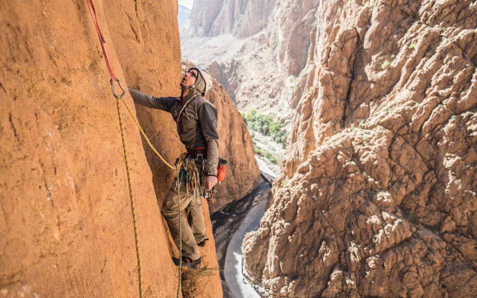 Man rock climbing on Atlas Mountains, Morocco