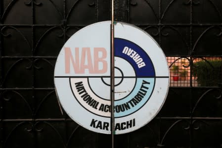 FILE PHOTO: A logo of the National Accountability Bureau (NAB) is seen on the main entrance of their office in Karachi