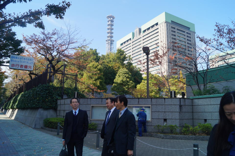 <p>Businessmen outside the Ministry of Defense Headquarters in Ichigaya, Shinjuku, Tokyo. (Photo: Michael Walsh/Yahoo News) </p>