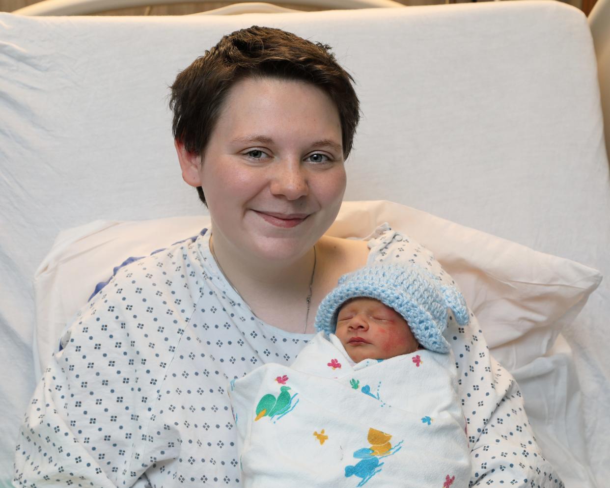 Mom Hailee Potter Simmons cradles her son, Ricco Greyson Via, the first baby of 2023 born at Augusta Health in Fishersville.