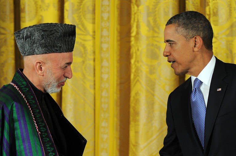 US President Barack Obama and his Afghan counterpart Hamid Karzai leave after a joint press conference at the White House on January 11, 2013. Obama has said the US goal in Afghanistan was "within reach" as he vowed to move ahead with a timetable to end the 11-year-old military campaign and focus on a broad domestic agenda
