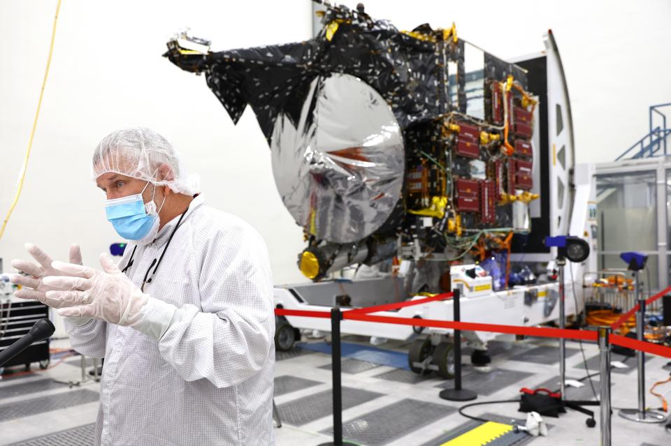 Psyche project manager Henry Stone speaks in April 2022 next to the Psyche mission spacecraft at NASA's Jet Propulsion Laboratory. The NASA spacecraft is scheduled to launch in October on a solar-powered 1.5 billion mile journey toward the giant metal-rich asteroid Psyche.