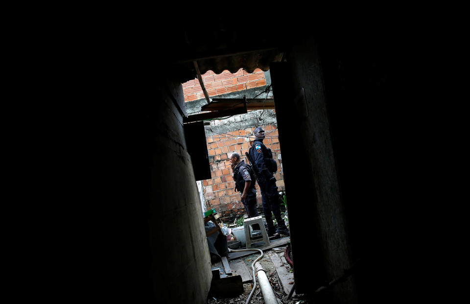 Policemen are pictured during an operation against drug dealers in Cidade de Deus or City of God slum in Rio de Janeiro