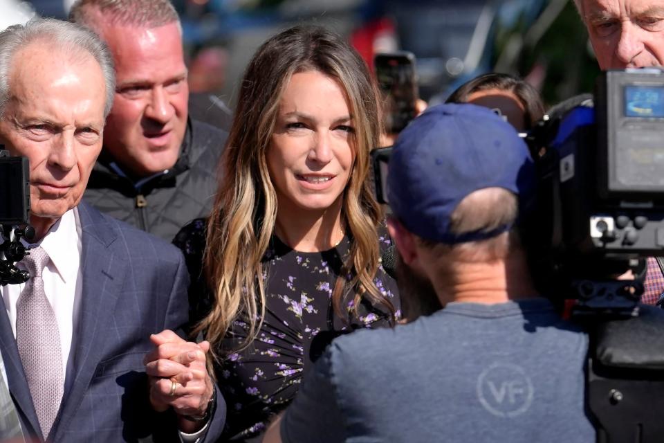 Karen Read, center, arrives at Norfolk Superior Court with her father William Read, left, Tuesday, June 25, 2024, in Dedham, Mass. Karen Read is on trial, accused of killing her boyfriend Boston police Officer John O'Keefe, in 2022. (AP Photo/Steven Senne)