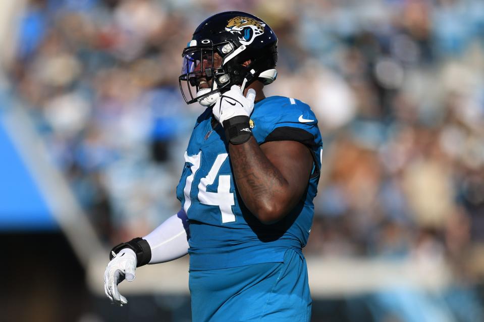 Jacksonville Jaguars offensive tackle Cam Robinson (74) walks off the field after being ejected for fighting with Carolina Panthers defensive tackle Derrick Brown (95), not shown, during the fourth quarter of a regular season NFL football matchup Sunday, Dec. 31, 2023 at EverBank Stadium in Jacksonville, Fla. The Jacksonville Jaguars blanked the Carolina Panthers 26-0. [Corey Perrine/Florida Times-Union]