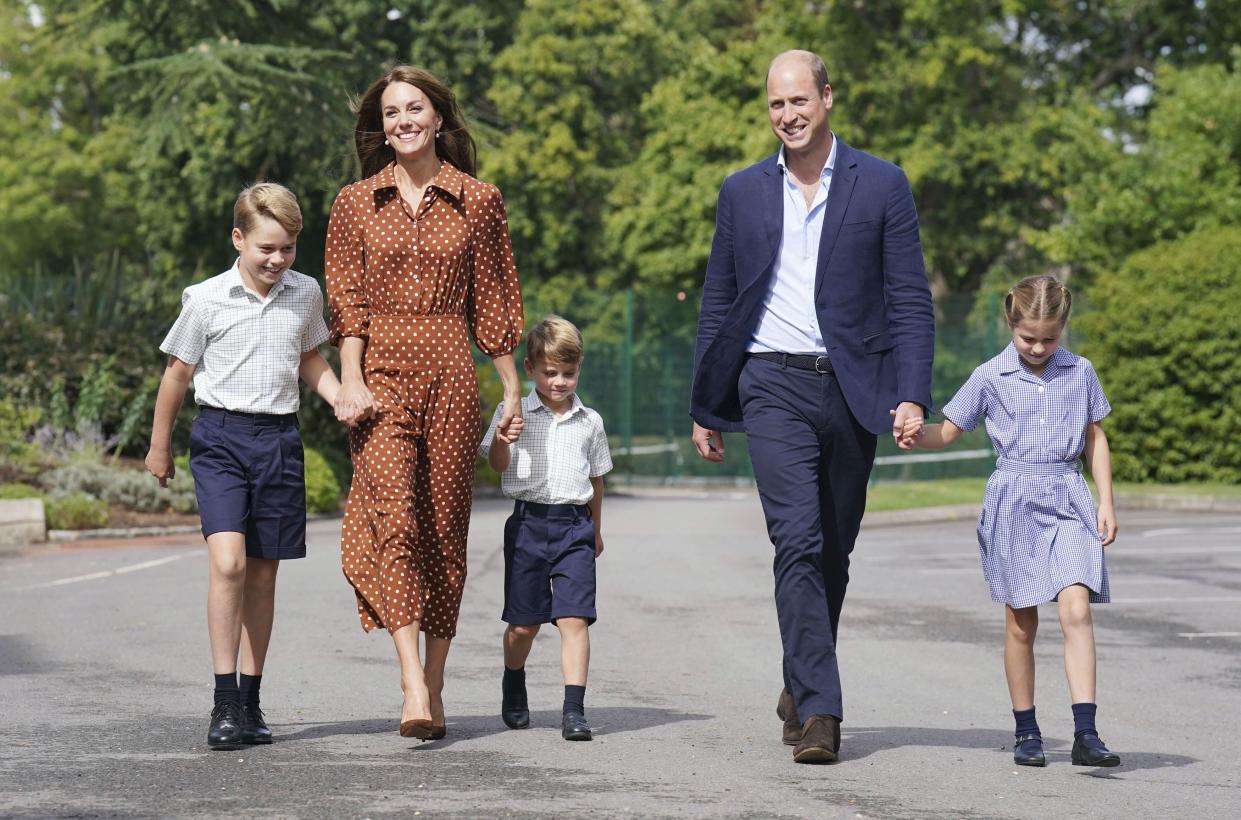 From left, Britain's Prince George, Kate Duchess of Cambridge, Prince Louis, Prince William and Princess Charlotte, arrive at Lambrook School Wednesday.