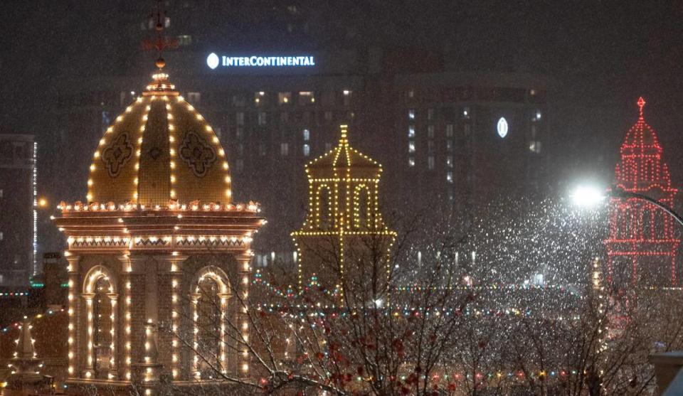 The Plaza Lights shine brightly as the season’s first snow falls on Saturday, Nov. 25, 2023, in Kansas City.