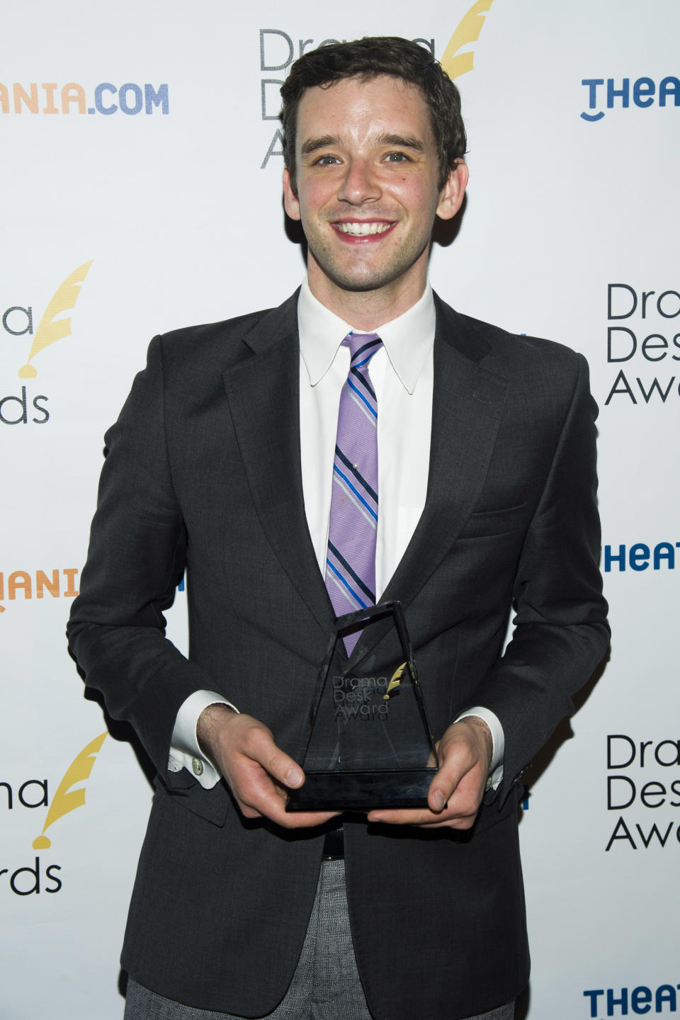 FILE - This May 19, 2013 file photo shows Michael Urie holding his award for outstanding solo performance for his role in "Buyer & Cellar," at the 2013 Drama Desk Awards in New York. The Juilliard-trained Urie plays a struggling actor who lands a job as a clerk in an underground mall of quaint shops. (Photo by Charles Sykes/Invision/AP, file)