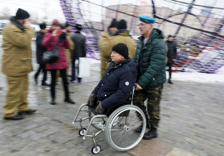 Participants, including veterans of the military campaign, gather before a ceremony marking the 30th anniversary of the withdrawal of Soviet troops from Afghanistan at Victory Park, also known as Poklonnaya Gora War Memorial Park, in Moscow, Russia February 15, 2019. REUTERS/Shamil Zhumatov