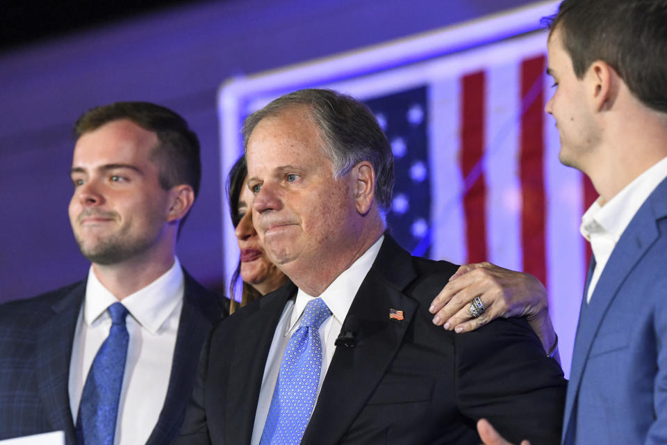 FILE - In this Nov.3, 2020 file photo, Sen. Doug Jones, R-Alabama, becomes emotional near the end of his concession speech during his election night watch party in Birmingham, Ala. President-elect Joe Biden is eyeing several Democrats who lost congressional reelection races last month for key positions in his administration. They include outgoing Reps. Abby Finkenauer of Iowa and Donna Shalala of Florida and Sen. Doug Jones of Alabama. (AP Photo/Julie Bennett)