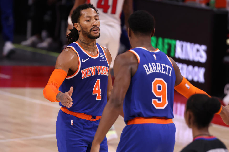 Derrick Rose #4 of the New York Knicks celebrates with RJ Barrett #9 during the second half while playing the Detroit Pistons at Little Caesars Arena on February 28, 2021 in Detroit, Michigan. NOTE TO USER: User expressly acknowledges and agrees that, by downloading and or using this photograph, User is consenting to the terms and conditions of the Getty Images License Agreement. (Photo by Gregory Shamus/Getty Images)