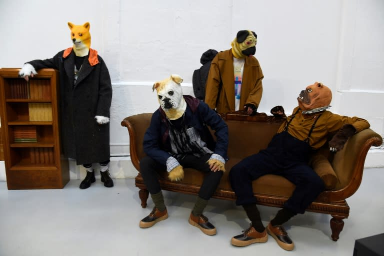 French designer Julien David sent out his models wearing dog's heads, from a macho, man-spreading Doberman to an intellectual whippet and a splayed poodle in dungarees