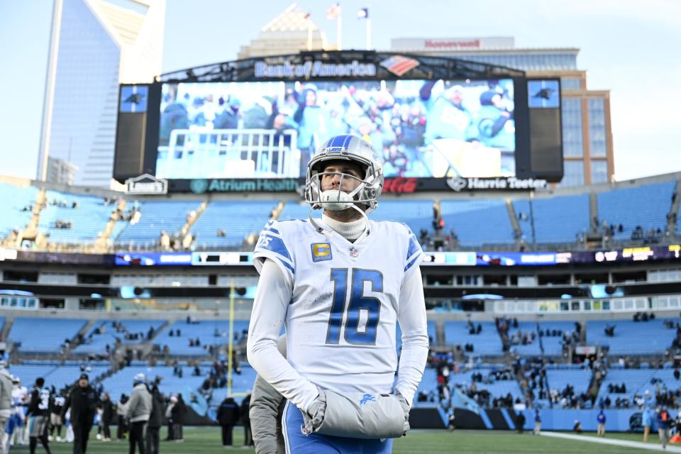 Jared Goff (16) of the Detroit Lions walks off the field after the game against the Carolina Panthers at Bank of America Stadium on December 24, 2022 in Charlotte, North Carolina.