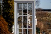 The Wider Image: Japan's tsunami survivors call lost loves on the phone of the wind