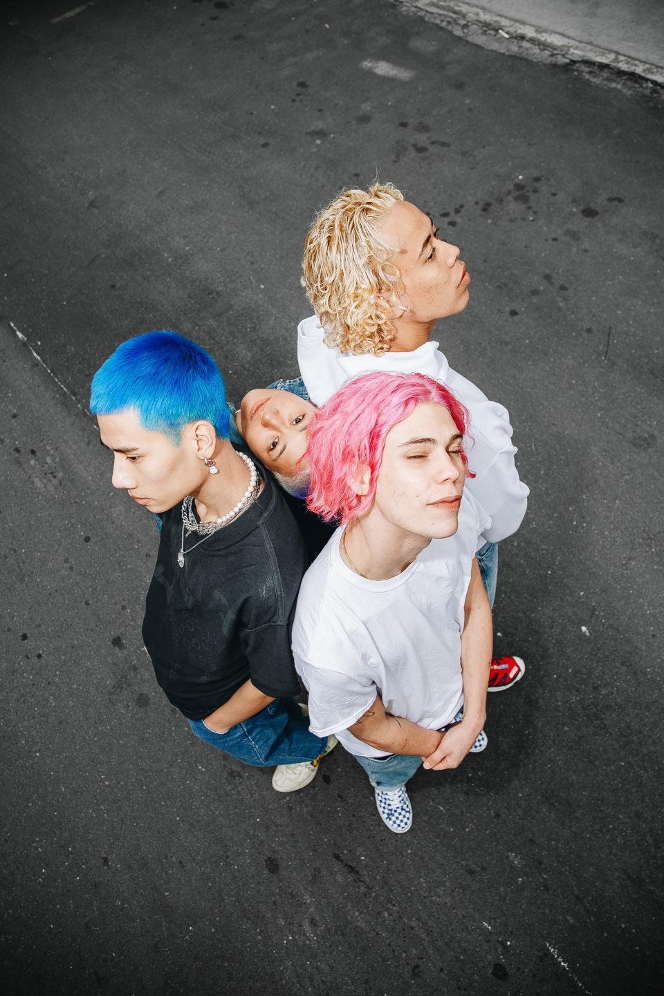 Clockwise from left: Ng traded his signature neon green hair for deep blue; Nicole got a purple ombré fade; Sow opted for an Irish-cream blond done with lightener and toner; it took five hours to get Korsan’s hair from brown to pink.