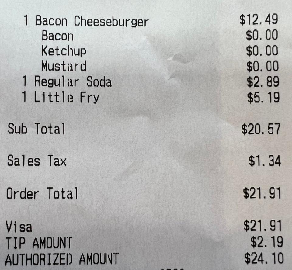 The Five Guys receipt shows a cheeseburger alone cost $12.49. Wall Street Silver/X