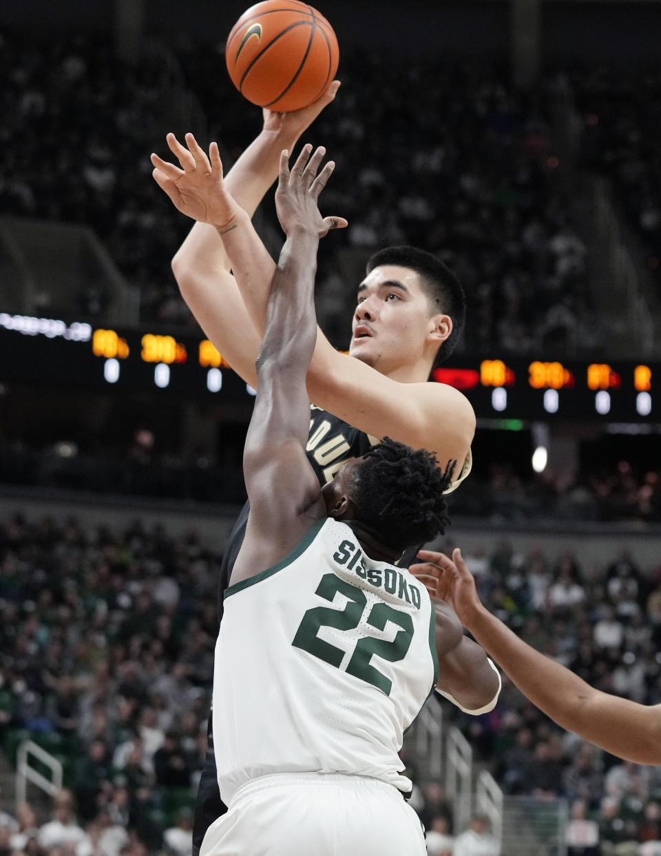 Purdue center Zach Edey shoots over the defense of Michigan State center Mady Sissoko (22) during the first half of an NCAA college basketball game, Monday, Jan. 16, 2023, in East Lansing, Mich. (AP Photo/Carlos Osorio)