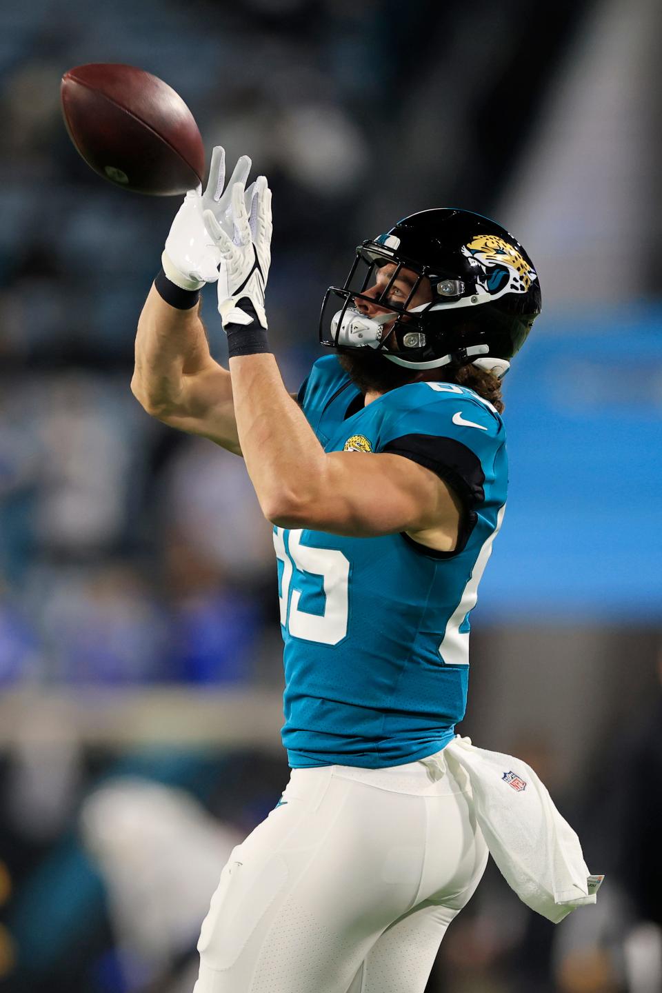 Jacksonville Jaguars tight end Dan Arnold (85) hauls in a pass before an NFL first round playoff football matchup between the Jacksonville Jaguars and the Los Angeles Chargers Saturday, Jan. 14, 2023 at TIAA Bank Field in Jacksonville, Fla. The Jacksonville Jaguars edged the Los Angeles Chargers on a field goal 31-30. [Corey Perrine/Florida Times-Union]