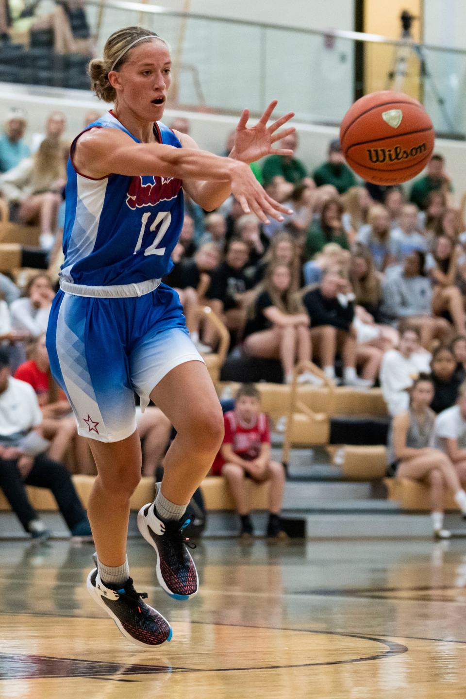 Junior All-Stars Ashlynn Shade (12) passes the ball during the game against the Indiana All-Stars on Wednesday, June 8, 2022, at Mt. Vernon High School in Fortville.
