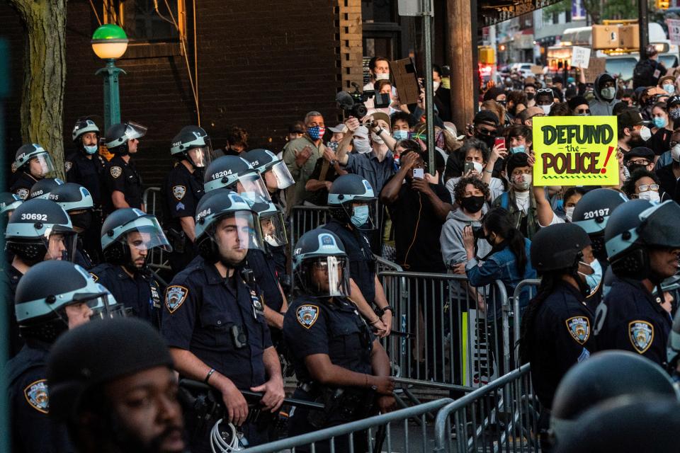 FILE PHOTO: Protesters rally against the death in Minneapolis police custody of George Floyd, at the Barclays Center in the Brooklyn borough of New York City, U.S., May 31, 2020. Picture taken May 31, 2020. REUTERS/Jeenah Moon