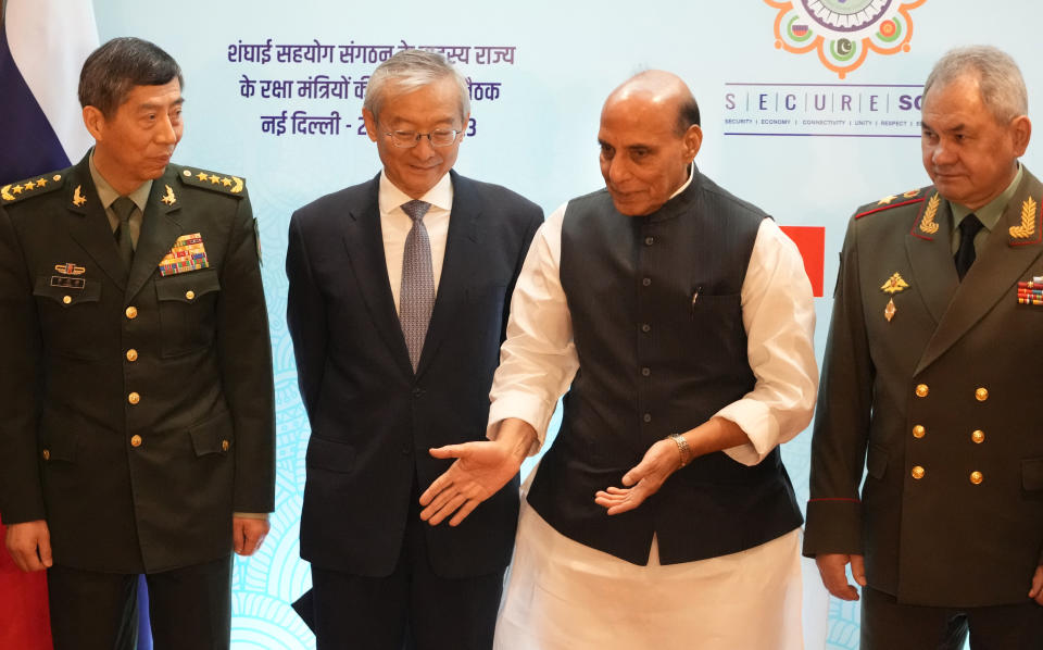 Indian Defense Minister Rajnath Singh, second left, talks with his Russian counterparts Sergei Shoigu, right, Chinese General Li Shangfu, left, and Secretary-General of the Shanghai Cooperation Organization (SCO) Zhang Ming before the start of SCO meeting, in New Delhi, India, Friday, April 28, 2023. (AP Photo/Manish Swarup)