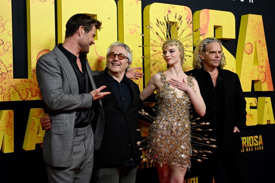 Chris Hemsworth, director George Miller, actress Anya Taylor-Joy, and producer Doug Mitchell posing together on the red carpet at the 'Furiosa: A Mad Max Saga' premiere in Sydney, Australia, May 2024.