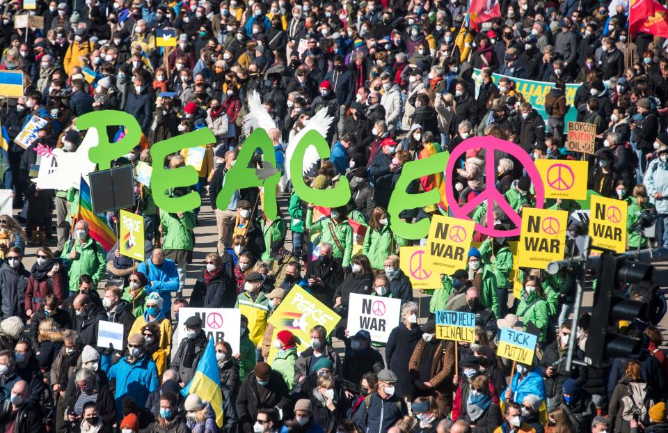 People take part in a protest against the Ukraine conflict in Hamburg, Germany, Sunday, March 13, 2022.  