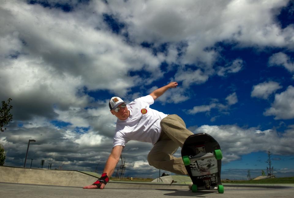 Erik Andersen of Stockton skates under a canopy of cloudy skies at the Lathrop Generations Center skate park in Lathrop. The clouds ad visual interest to the background.