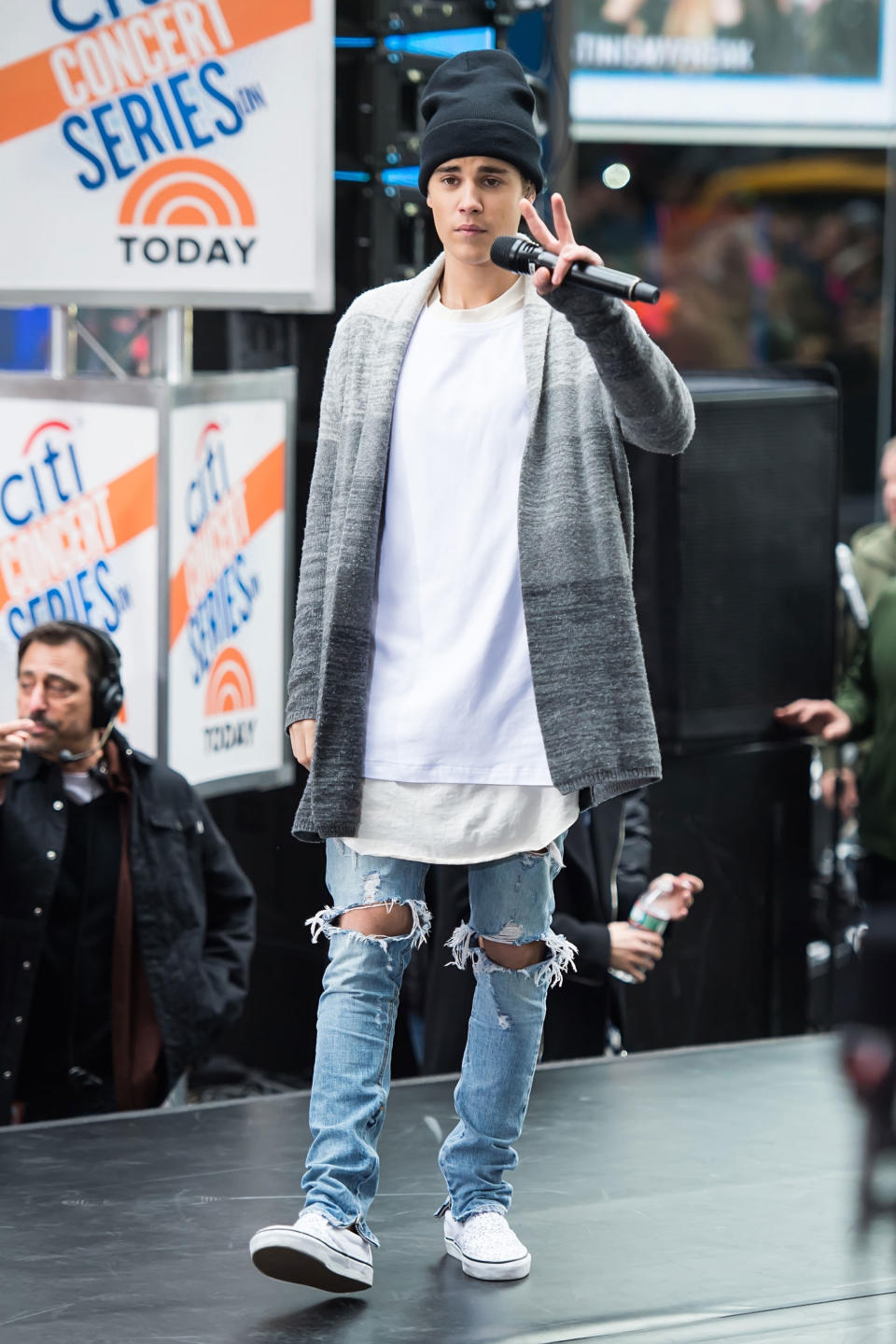 <p>To some people, a long gray cardigan is just a thing they keep on the back of their chair for when it gets cold at the office. But Bieber sees its true performance swag potential. It's called vision, people, and Bieber's got it. Yes, he do!</p>