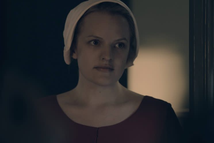 Elisabeth Moss as Offred.