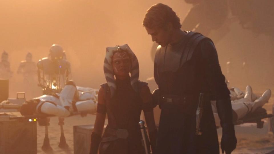 Anakin Skywalker speaks to young Ahsoka Tanow ith injured clone troopes behind them