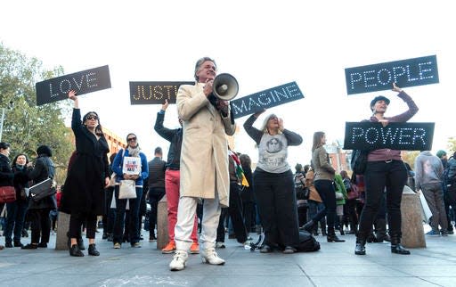 Rev. Billy Talen, deacon of The Church of Stop Shopping, addresses a protest rally at Washington Square Park in New York in 2016.