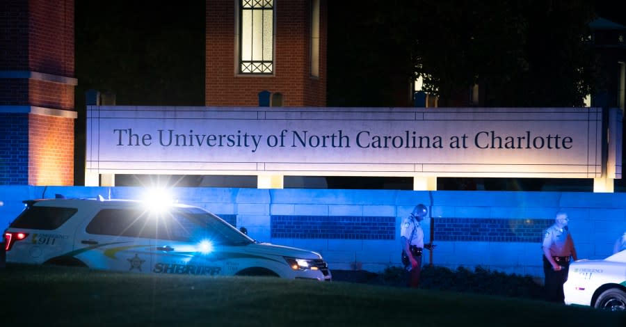 Police secure the main entrance to UNC Charlotte after a shooting incident at the school that left at least two people dead, Tuesday, April 30, 2019. (AP Photo/Jason E. Miczek)