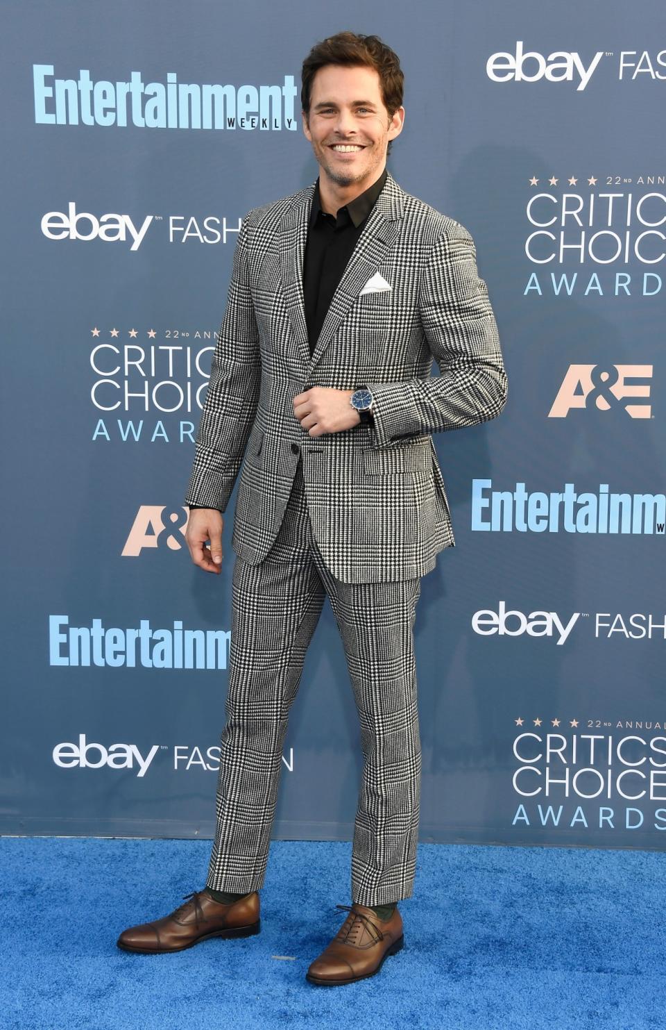 <p>James chose a houndstooth suit, standing out on the blue carpet. <i>[Photo: Getty]</i> </p>