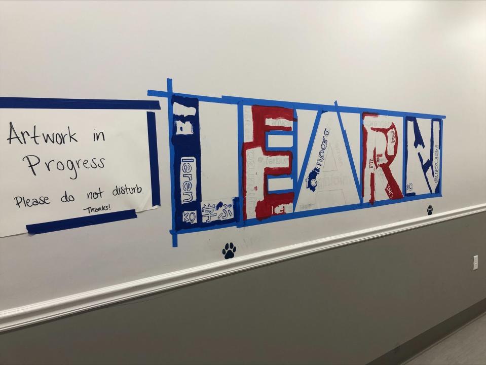 Students create a legacy at the school through their mural.