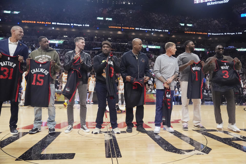 Former Miami Heat players are introduced before a half time ceremony honoring Udonis Haslem at an NBA basketball game against the Atlanta Hawks, Friday, Jan. 19, 2024, in Miami. (AP Photo/Marta Lavandier)