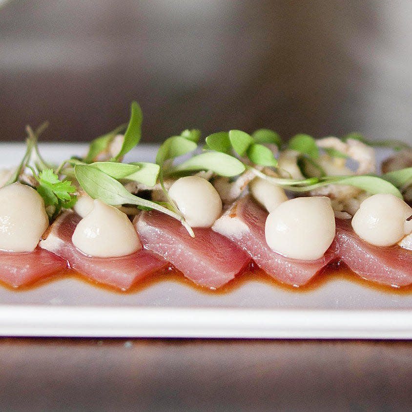 Tuna tataki with pickled hon shimeji mushrooms, myoga, avocado puree and shallot rings.