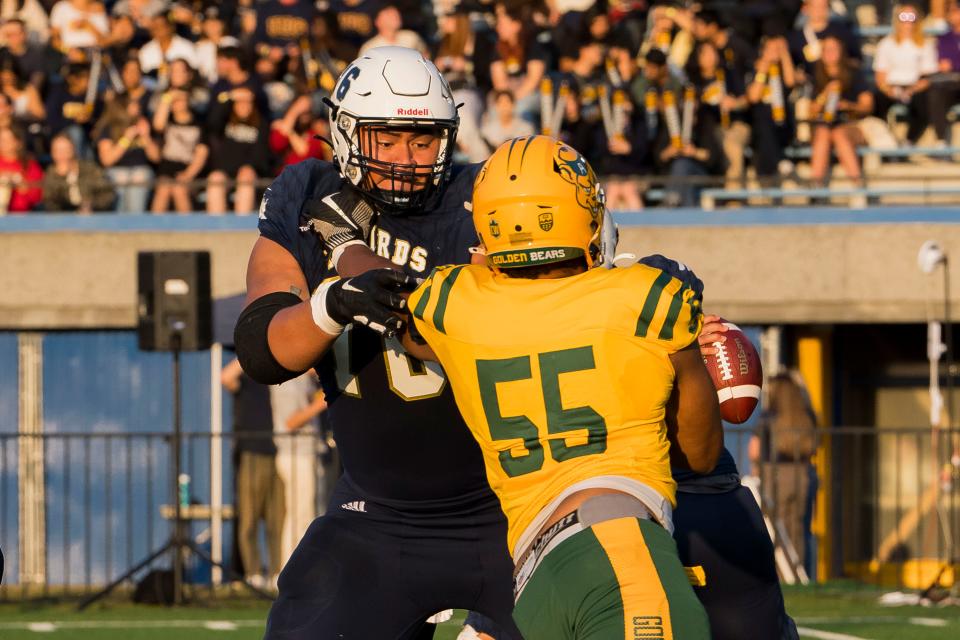 Giovanni Manu blocking during a game.