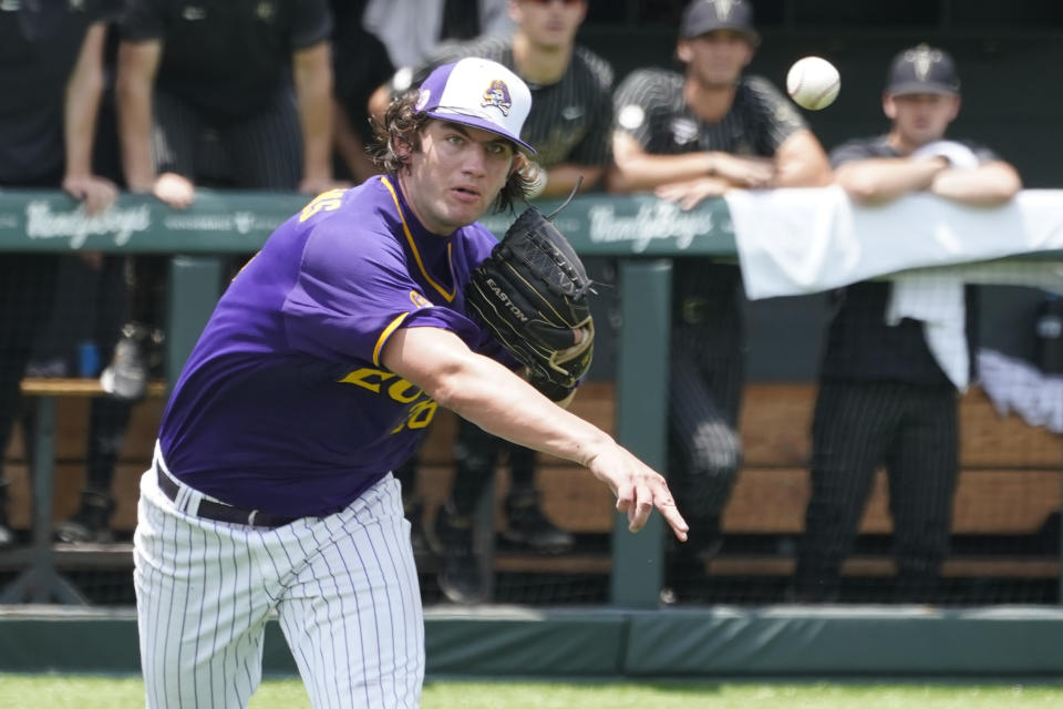 East Carolina pitcher Gavin Williams throws to first base too late on a bunt single by Vanderbilt's Javier Vaz in the seventh inning of an NCAA college baseball super regional game Friday, June 11, 2021, in Nashville, Tenn. Vanderbilt won 2-0. (AP Photo/Mark Humphrey)