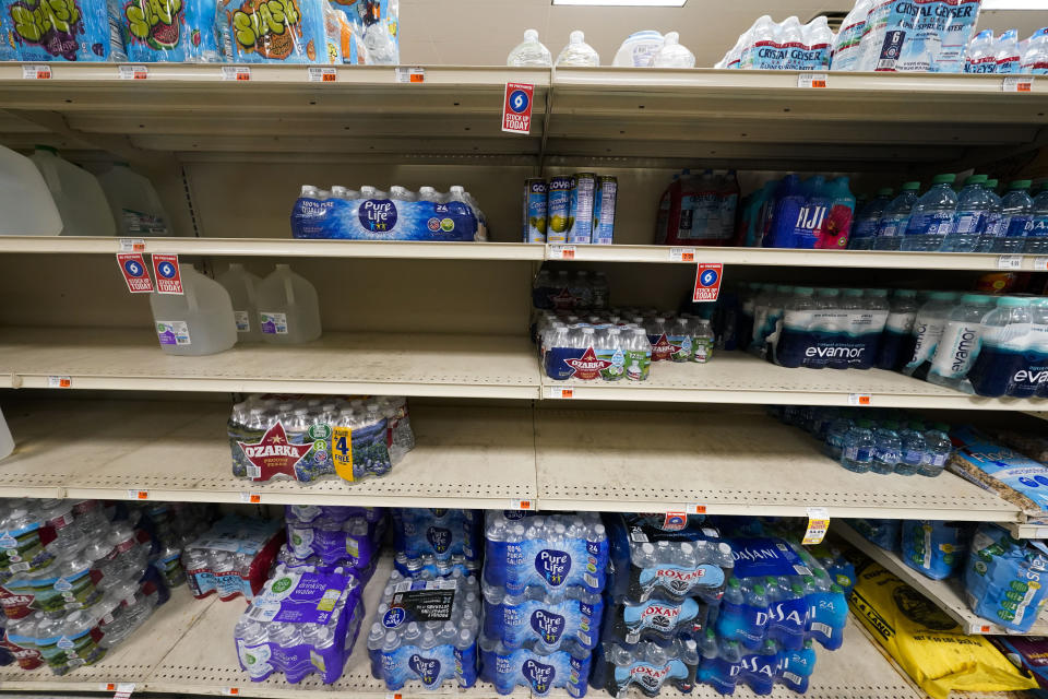 Water is seen on shelves in Fremins Food market in Port Sulphur, La., Monday, Sept. 25, 2023. A salt water wedge from the Gulf of Mexico is progressing upriver due to the unusually low water level in the river, with the potential to compromise municipal water systems along the river. (AP Photo/Gerald Herbert)