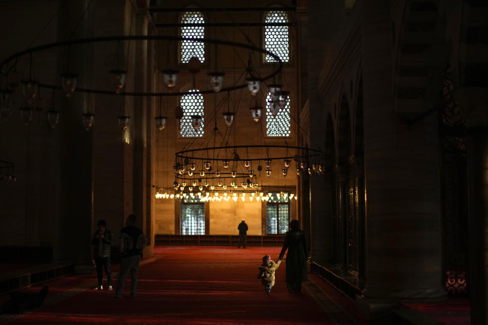 A Muslim worshipper prays in Suleymaniye mosque in Istanbul, Turkey, Friday, Oct. 28, 2022. Turkish President Recep Tayyip Erdogan on Friday laid out his vision for Turkey in the next century, promising a new constitution that would guarantee the rights and freedoms of citizens. (AP Photo/Francisco Seco)