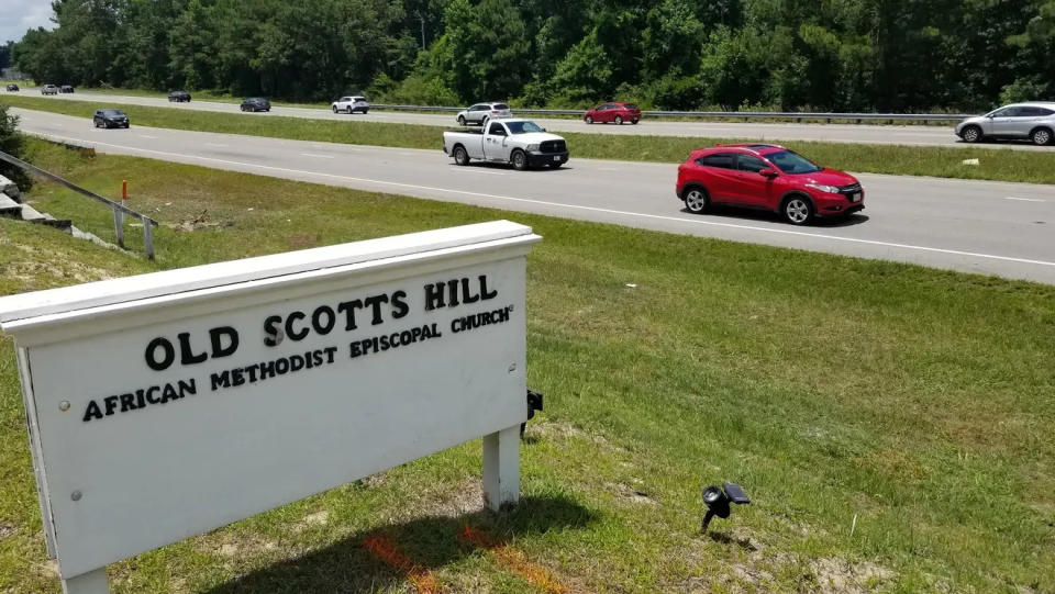 Traffic passes the Old Scotts Hill AME Church, which is by the historic grounds where the Scott family once lived.