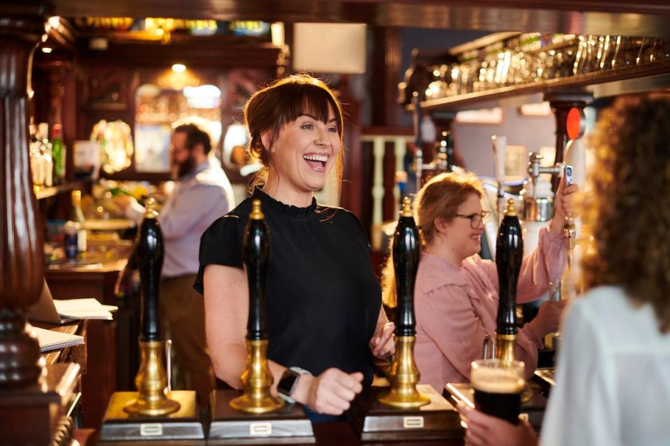 A bartender taking an order.