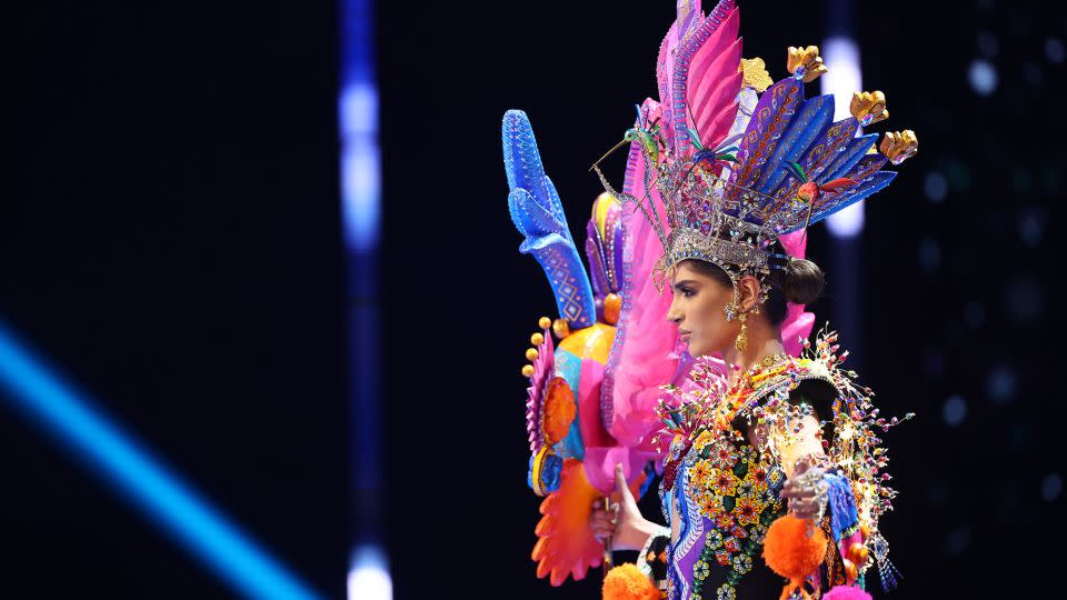 Miss Mexico wore a colorful look showcasing mythical creatures — a magical owl and deer, respectively, that represent wisdom and focus in traditional folklore. - Hector Vivas/Getty Images