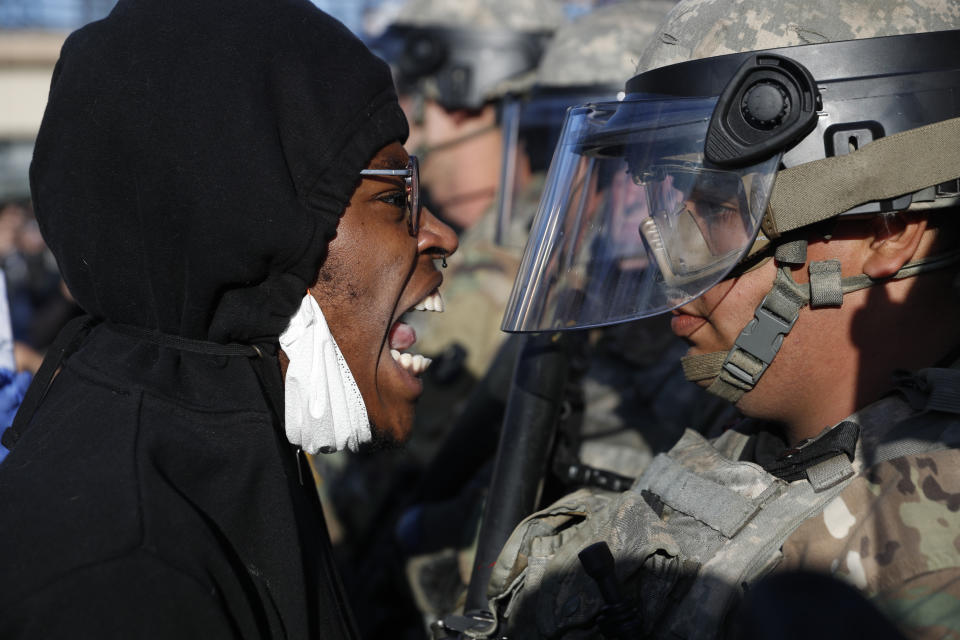 A protester yells at a member of the Minnesota National Guard Friday, May 29, 2020, in Minneapolis. Protests continued following the death of George Floyd, who died after being restrained by Minneapolis police officers on Memorial Day. (AP Photo/John Minchillo)