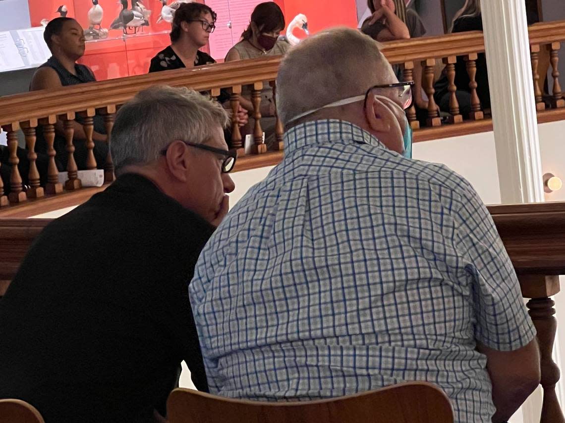 Bellingham Mayor Seth Fleetwood, left, watches the “Lens on Law Enforcement and the Legislature” town hall meeting in the Rotunda Room of the Whatcom Museum’s Old City Hall galleries on Tuesday, Sept. 20, in Bellingham.