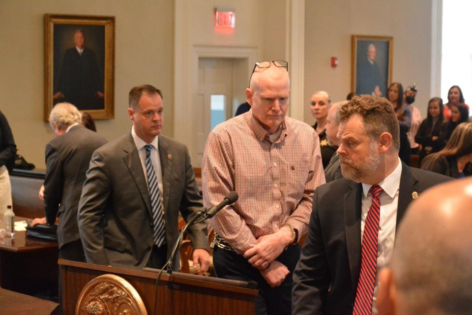 Alex Murdaugh, center, leaving the Colleton County courtroom Monday after a contentious hearing. Faced with double murder charges, Murdaugh will soon have a look at the evidence the state plans to use against him during the trial, which may take place as early as January.