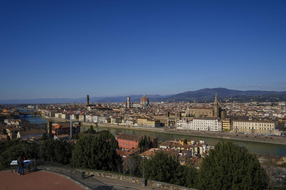 A view of Florence, central Italy, as seen from Michelangelo's square, Tuesday, Feb. 7, 2023. Florence's St. John's Baptistery's dome is undergoing a restoration work that will be done from an innovative scaffolding shaped like a giant mushroom that will stand for the next six years in the center of the church, and that will be open to visitors allowing them for the first and perhaps only time, to come come face to face with more than 1,000 square meters of precious mosaics covering the dome. (AP Photo/Andrew Medichini)