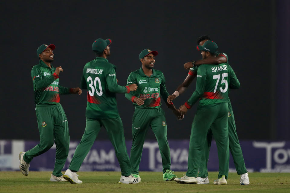 Bangladesh's players celebrate the wicket of India's Axar Patel during the second one day international cricket match between Bangladesh and India in Dhaka, Bangladesh, Wednesday, Dec. 7, 2022. (AP Photo/Surjeet Yadav)